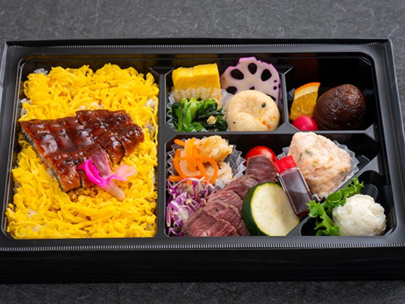うなぎの蒲焼きとステーキの色彩弁当